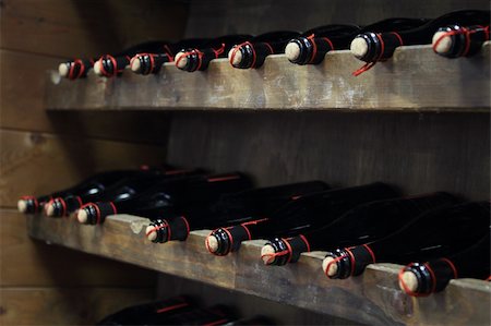 production line food - Bottles of red wine in rows in wine cellar Stock Photo - Budget Royalty-Free & Subscription, Code: 400-05374294