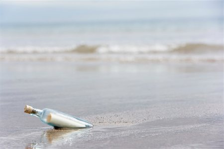 Message In A Bottle Buried In Sand On The Beach Stock Photo - Budget Royalty-Free & Subscription, Code: 400-05374565