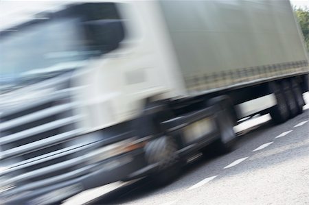 semi truck low angle - Truck Driving Along The Road Stock Photo - Budget Royalty-Free & Subscription, Code: 400-05375374