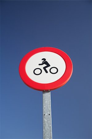 sign road paint - motorbikes forbidden red circle traffic sign at Spain Stock Photo - Budget Royalty-Free & Subscription, Code: 400-05376685