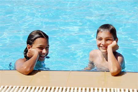 pools interior exterior - smiling girl and boy in blue swimming pool portrait Stock Photo - Budget Royalty-Free & Subscription, Code: 400-05376800