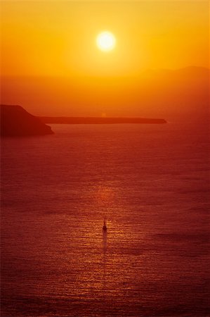 santorini sunset pictures - An image of a beautiful sunset over the ocean Santorini Stock Photo - Budget Royalty-Free & Subscription, Code: 400-05377002