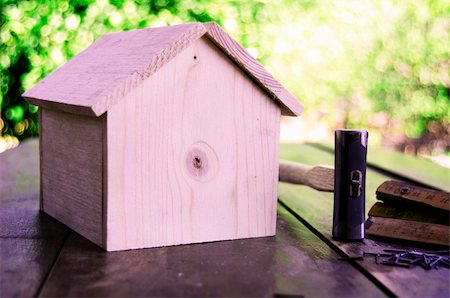 roof hammer - Small wooden house with hammer nails and ruler Stock Photo - Budget Royalty-Free & Subscription, Code: 400-05377237