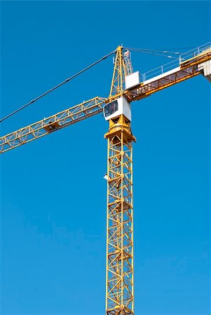 Yellow crane on blue sky background Stock Photo - Budget Royalty-Free & Subscription, Code: 400-05378778