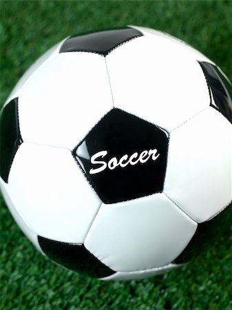 simsearch:400-08372849,k - Black and white soccer balls isolated on artificial grass Stock Photo - Budget Royalty-Free & Subscription, Code: 400-05379126
