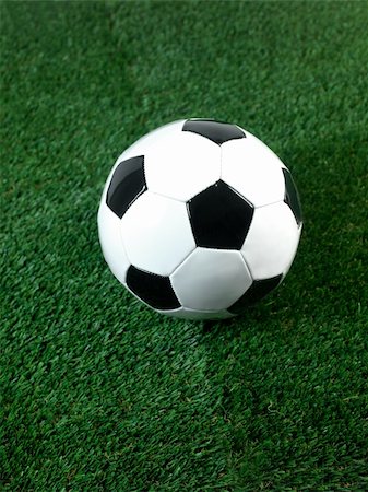 simsearch:400-08372849,k - Black and white soccer balls isolated on artificial grass Stock Photo - Budget Royalty-Free & Subscription, Code: 400-05379166