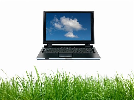 A laptop floating above green grass siolated against a white background Stock Photo - Budget Royalty-Free & Subscription, Code: 400-05379160