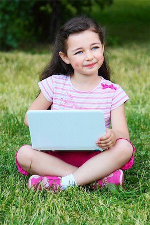 rain little girl - The small nice girl with the laptop on walk in park Photographie de stock - Aubaine LD & Abonnement, Code: 400-05379306