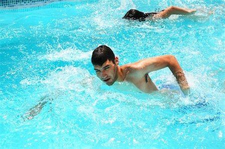 Couple having fun in swimming pool. Stock Photo - Budget Royalty-Free & Subscription, Code: 400-05379312