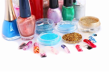 Nail polishes,glitters and nail figures isolated on white background. Stock Photo - Budget Royalty-Free & Subscription, Code: 400-05379401