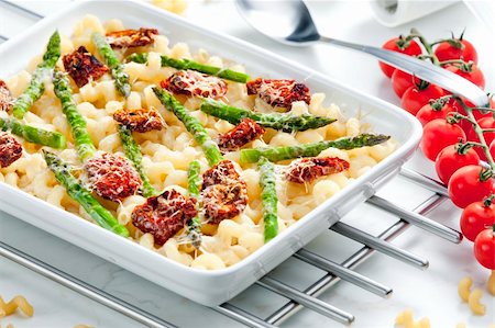 pasta baked with dried tomatoes, asparagus and pecorino cheese Stock Photo - Budget Royalty-Free & Subscription, Code: 400-05379762