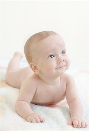 simsearch:400-04100917,k - aby boy on his stomach. Looking up Stock Photo - Budget Royalty-Free & Subscription, Code: 400-05370260