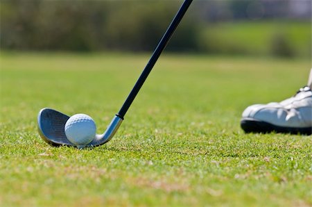 A real golfer in a golf course getting ready to strike the ball. Stock Photo - Budget Royalty-Free & Subscription, Code: 400-05370464