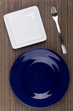 restaurant in blue with table setting - Ceramic plates for table on a brown background. Stock Photo - Budget Royalty-Free & Subscription, Code: 400-05370899
