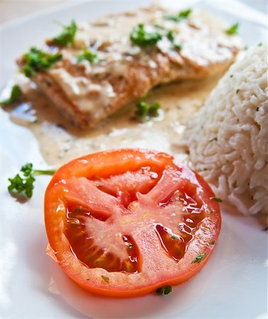 poached salmon - grilled salmon and rice-french cuisine dish with tomato and salmon Stock Photo - Budget Royalty-Free & Subscription, Code: 400-05371204