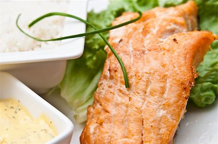 poached salmon - grilled salmon and lemon - french cuisine dish with tomato and salmon Stock Photo - Budget Royalty-Free & Subscription, Code: 400-05371306