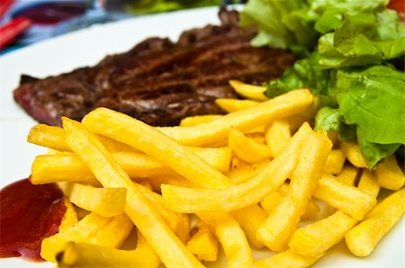 simsearch:400-05664697,k - juicy steak beef meat with tomato and french fries Stock Photo - Budget Royalty-Free & Subscription, Code: 400-05371314