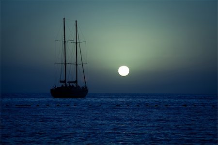 sailing on atlantic ocean - silhouette of a sailboat at sunset in the sea Stock Photo - Budget Royalty-Free & Subscription, Code: 400-05371419