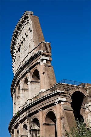 round amphitheatre - Colosseum in Rome with blue sky, landmark of the city Stock Photo - Budget Royalty-Free & Subscription, Code: 400-05371827