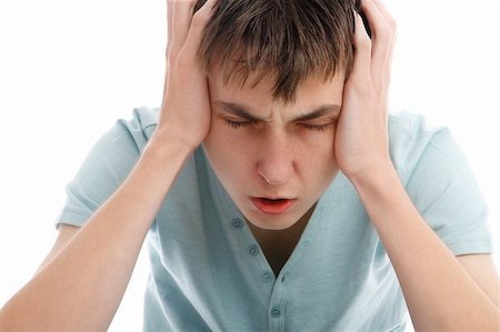 defeated boy - A teen boy showing signs of a headache, migrain or stress. Stock Photo - Budget Royalty-Free & Subscription, Code: 400-05371978