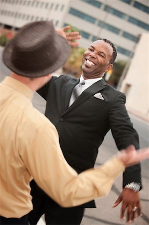 Two successful businessmen high five each other Stock Photo - Budget Royalty-Free & Subscription, Code: 400-05372601