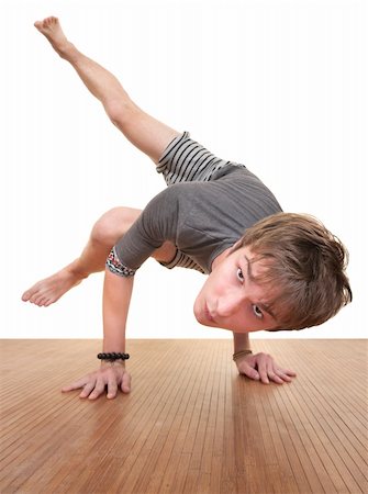 simsearch:400-04328141,k - Caucasian teen in Koundinyasana posture over white background Stock Photo - Budget Royalty-Free & Subscription, Code: 400-05372652