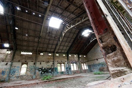 abandoned industrial hall with broken windows and grunge graffiti all over. Stock Photo - Budget Royalty-Free & Subscription, Code: 400-05384069