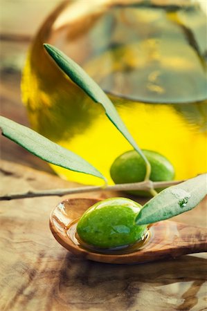 simsearch:400-05666507,k - Extra virgin healthy Olive oil with fresh olives on rustic wooden background Stock Photo - Budget Royalty-Free & Subscription, Code: 400-05384539
