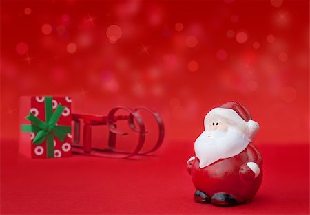 simsearch:400-07218254,k - Santa Claus with sledge and present and defocused lights. Stock Photo - Budget Royalty-Free & Subscription, Code: 400-05384726