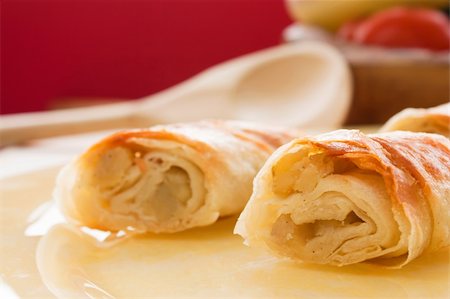 rustic tray - Potato filo pastry with vegetables and cutlery in the back. Stock Photo - Budget Royalty-Free & Subscription, Code: 400-05384747