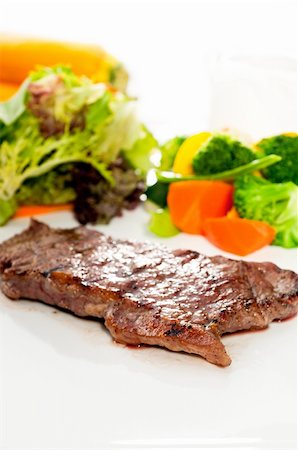 juicy BBQ grilled rib eye ,ribeye steak ,vegetables on background Stock Photo - Budget Royalty-Free & Subscription, Code: 400-05384904