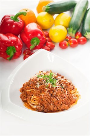 simsearch:400-09096113,k - Italian classic  spaghetti with bolognese sauce and fresh vegetables on background Photographie de stock - Aubaine LD & Abonnement, Code: 400-05384900