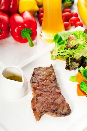 juicy BBQ grilled rib eye ,ribeye steak ,vegetables and lagher beer on background Stock Photo - Budget Royalty-Free & Subscription, Code: 400-05384903