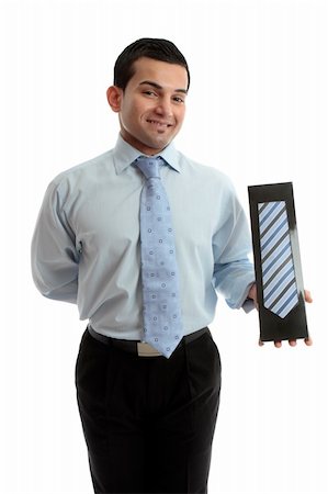 Smiling man holding a product or merchandise (or other object of your choice) Photographie de stock - Aubaine LD & Abonnement, Code: 400-05384922