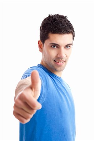 simsearch:400-04343310,k - Handsome young man with thumbs up on an isolated white background Photographie de stock - Aubaine LD & Abonnement, Code: 400-05385548