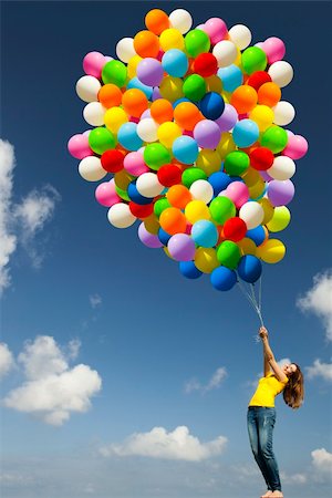 simsearch:400-06077546,k - Happy young woman with colorful balloons on a green meadow Stockbilder - Microstock & Abonnement, Bildnummer: 400-05385599