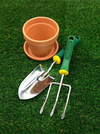 A watering can isolated against a white background Stock Photo - Budget Royalty-Free & Subscription, Code: 400-05385835