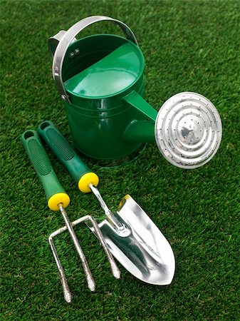 A watering can isolated against a white background Stock Photo - Budget Royalty-Free & Subscription, Code: 400-05385833