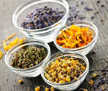 Assortment of dry medicinal herbs in glass bowls Photographie de stock - Aubaine LD & Abonnement, Code: 400-05386047
