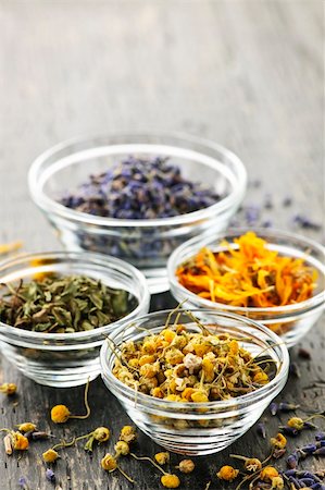 Assortment of dry medicinal herbs in glass bowls Photographie de stock - Aubaine LD & Abonnement, Code: 400-05386048
