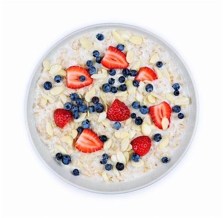 Bowl of hot oatmeal breakfast cereal with fresh berries from above Stock Photo - Budget Royalty-Free & Subscription, Code: 400-05386059