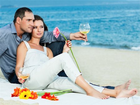 Young beautiful couple drinking wine on the beach Stock Photo - Budget Royalty-Free & Subscription, Code: 400-05386310