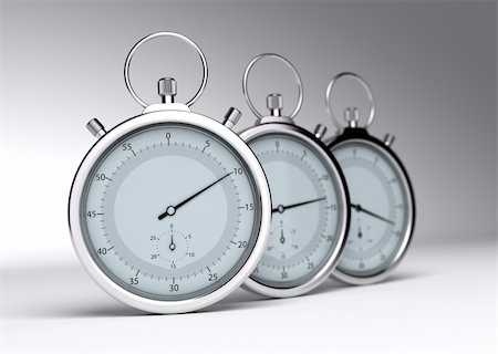 productivity concepts - three stopwatches over a grey background with blur Stock Photo - Budget Royalty-Free & Subscription, Code: 400-05386423