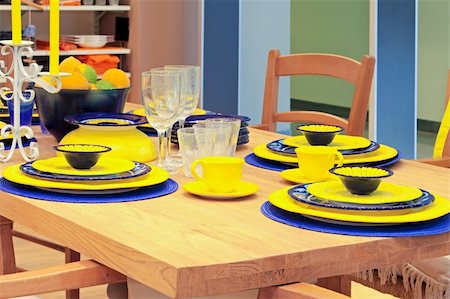 photography setup - Wooden dining table with yellow plates and mugs Stock Photo - Budget Royalty-Free & Subscription, Code: 400-05386653