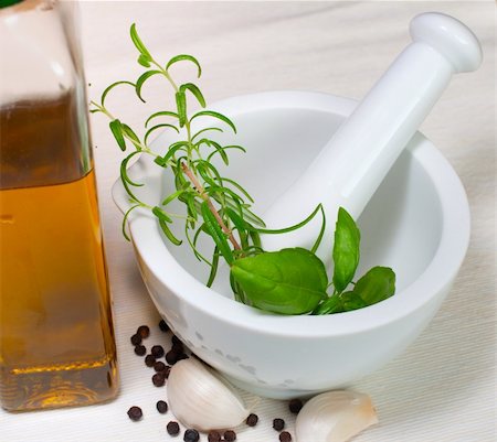simsearch:400-04846756,k - Marinade for barbecue in Mortar - Rosemary, basil, garlic, pepper and olive oil on table Stock Photo - Budget Royalty-Free & Subscription, Code: 400-05387639