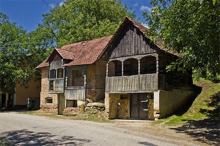 Traditional historic wooden houses in Zaistovec village, Croatia - used as wine cellars Stock Photo - Budget Royalty-Free & Subscription, Code: 400-05381168