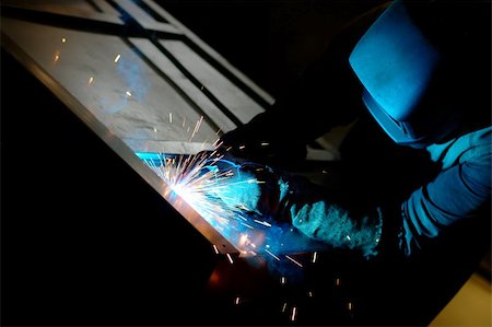 simsearch:400-05886105,k - Close-up photo of a welder at work with sparks flying around Photographie de stock - Aubaine LD & Abonnement, Code: 400-05381172