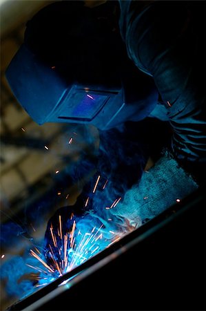 simsearch:400-05886105,k - Close-up photo of a welder at work with sparks flying around Photographie de stock - Aubaine LD & Abonnement, Code: 400-05381180