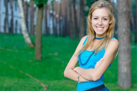 portrait photo teenage girl long blonde hair'''' - Close-up photo of a smiling young girl at the park Stock Photo - Budget Royalty-Free & Subscription, Code: 400-05381221