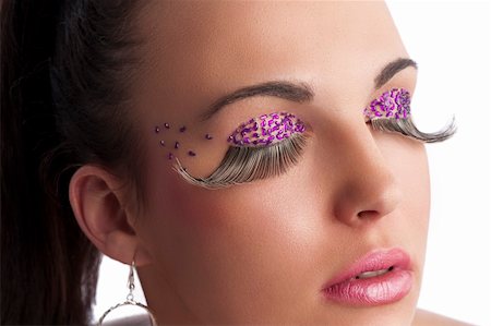simsearch:400-05314365,k - closeup on the face of beauty brunette with long false eyelashes and creative make up with colored gem stone Foto de stock - Royalty-Free Super Valor e Assinatura, Número: 400-05381331